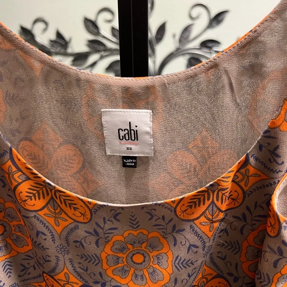 NWOT CAbi Floral Orange and Gray Lined Top Size XS